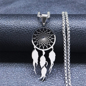 Silver dream catcher necklace on dark leather background – pendant detail