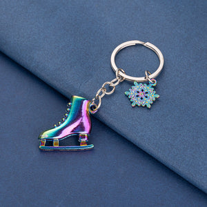 Colorful rainbow ice skate keychain – side angle on blue background