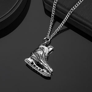 Ice skate pendant front view on dark background