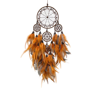 Tribal Mark dream catcher – coffee/brown colourway hanging on white wall