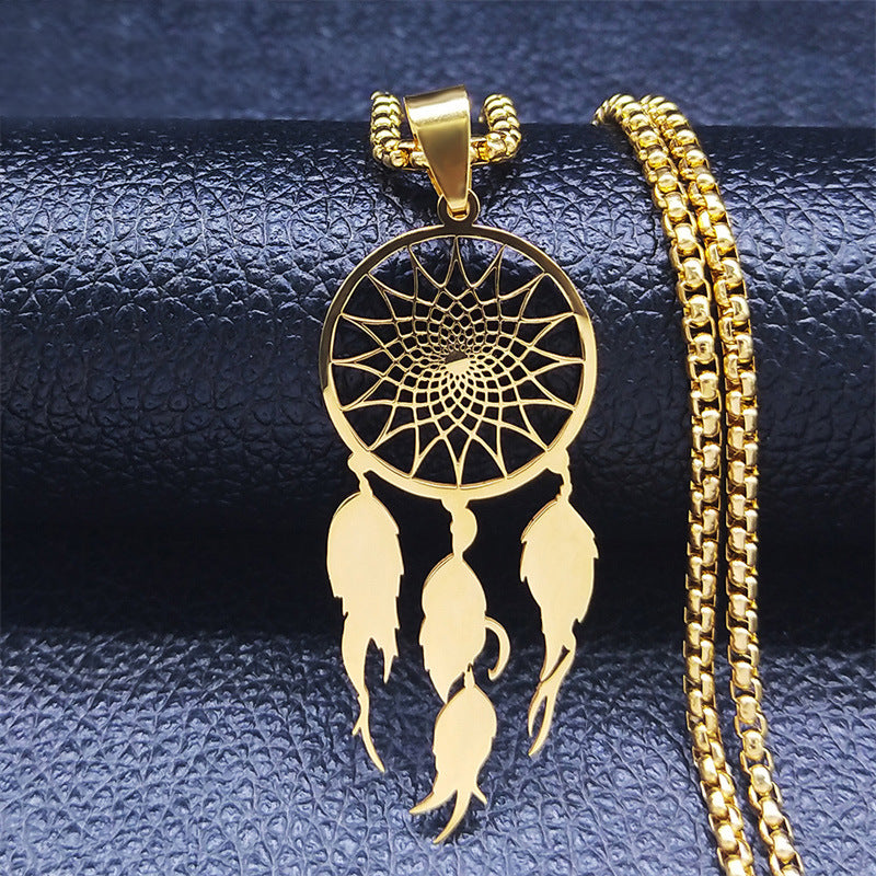 Gold dream catcher necklace close-up on dark background – pendant detail