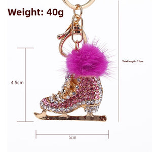 Red crystal ice skate pom pom keychain – product shot