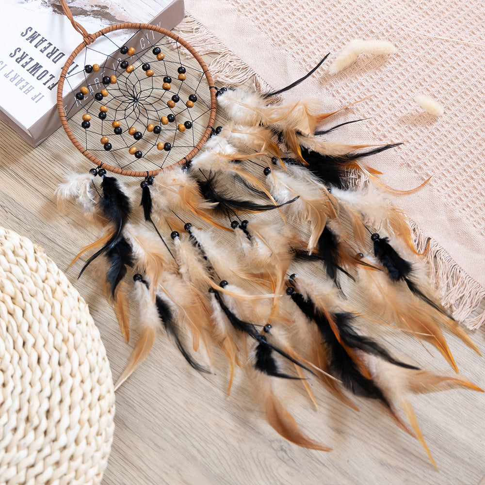 Dream catcher laid flat on wood surface