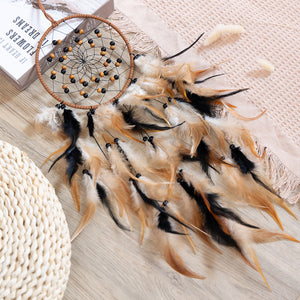 Dream catcher laid flat on wood surface