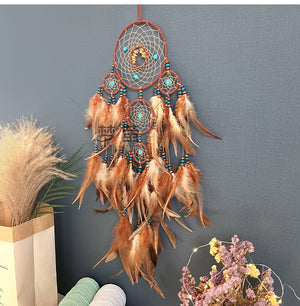 Dream catcher laid flat on white surface
